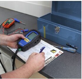 Checking boiler flue gas readings with a digital analyser during a service